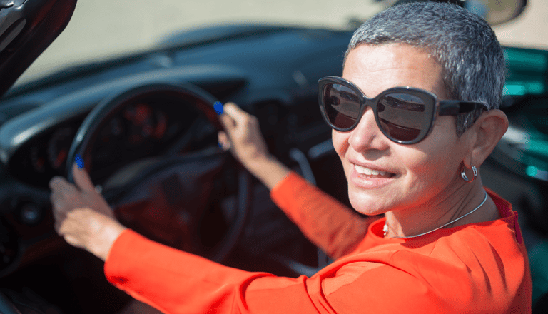 Older Modern Woman Driving A Car Covered by GAP